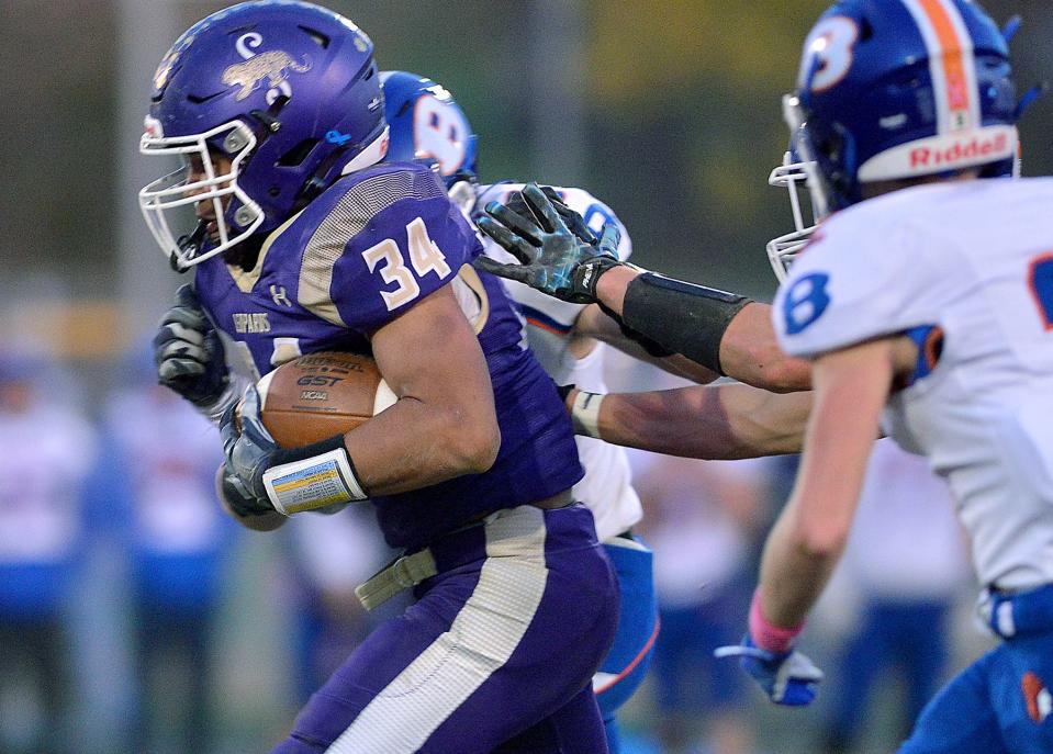 Smithsburg's Ashton Redman carries the ball on the play for the Leopards during the first half of Friday night's game against Boonsboro.