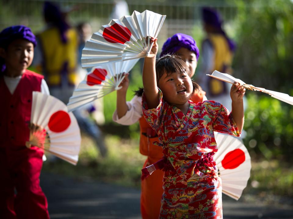 oung participants joins a modern Eisa folk dance in Higashi village during the Obon festival to honour the spirits of their ancestors on August 17, 2016, Okinawa prefecture, Japan.