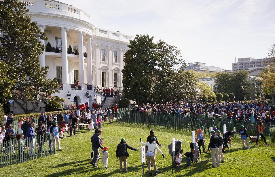 Throngs of children and parents gather on the South Lawn of the White House in Washington, Monday, April 21, 2014, for the annual White House Easter Egg Roll. Thousands of children are gathering at the White House for the annual Easter Egg Roll. President Barack Obama and first lady Michelle Obama will kick off the festivities on the White House South Lawn. This year's event features live music, cooking stations, storytelling, and of course, some Easter egg rolling. (AP Photo/J. Scott Applewhite)