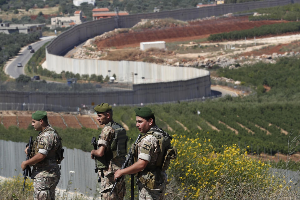 Lebanese army soldiers deploy at the Lebanese side of the Lebanese-Israeli border in the southern village of Kfar Kila, Lebanon, Saturday, May 15, 2021. (AP Photo/Hussein Malla)