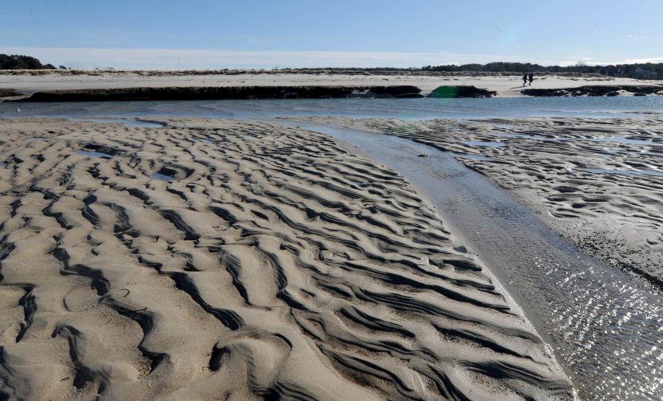 Ripples in the sand are exposed just after low tide Monday near the mouth of Quivett Creek, which was designated in a new report as having unacceptable water quality. The creek includes a large marsh area and is the waterway of the annual herring run to headwaters at Bound Brook.
