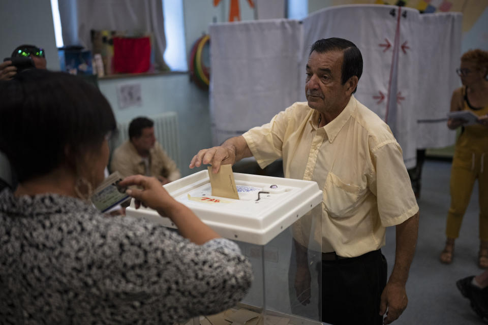 A man casts his ballot in the first round of the French parliamentary election, Sunday, June 12, 2022 in Marseille, southern France. Voters are choosing lawmakers as President Emmanuel Macron seeks to secure his majority while under growing threat from a leftist coalition. (AP Photo/Daniel Cole)