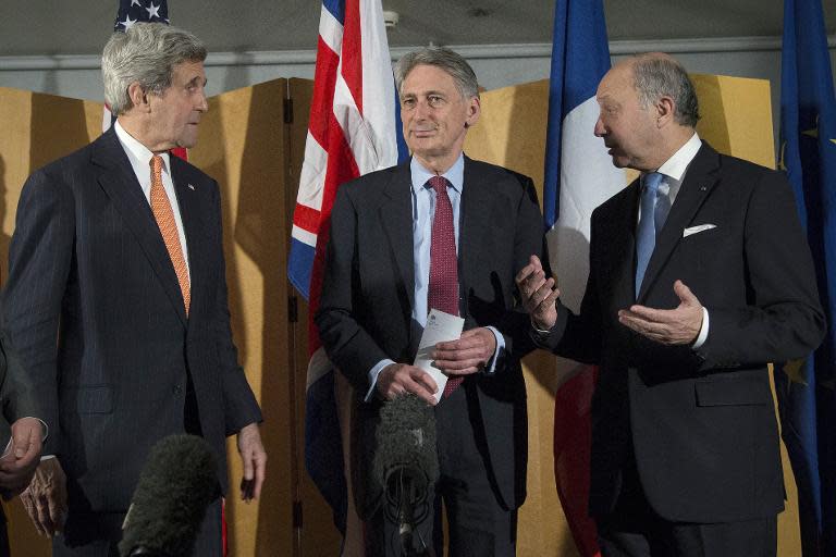 US Secretary of State John Kerry (L), British Foreign Secretary Philip Hammond (C) and French Foreign Minister Laurent Fabius (L) in London on March 21, 2015 after meeting on recent negotiations with Iran over its nuclear program