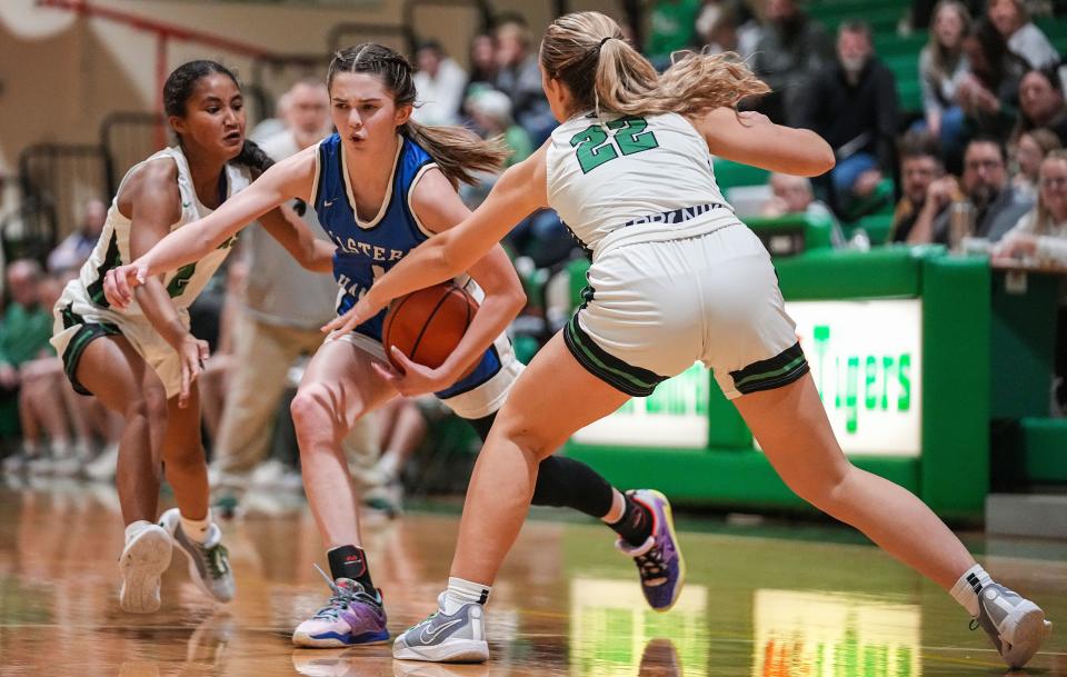 Eastern Hancock Royals McKenzie Koch (1) rushes up the court against Triton Central Tigers Maryrose Felling (22) on Saturday, Nov. 11, 2023, during the game at Triton Central High School in Fairland. The Eastern Hancock Royals defeated the Triton Central Tigers, 50-41.