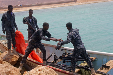 Somali Puntland forces receive weapons seized in a boat on the shores of the Gulf of Aden in the city of Bosasso, Puntland region, Somalia September 23, 2017. REUTERS/Abdiqani Hassan