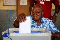 A man casts his ballot at a polling station during the legislative election in Abidjan