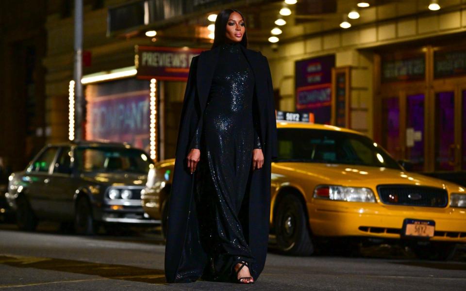 Naomi Campbell walks along 46th Street during the Michael Kors Fashion Show in Times Square on April 08, 2021  -  GC Images