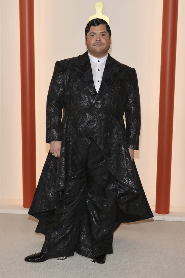 Harvey Guillen wearing Christian Siriano at the 95th Oscars