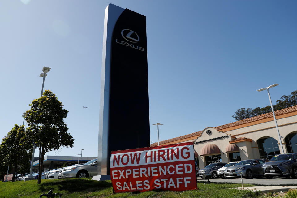 A now hiring sign is seen outside Lexus of Serramonte in Colma, California, U.S., October 3, 2017. REUTERS/Stephen Lam