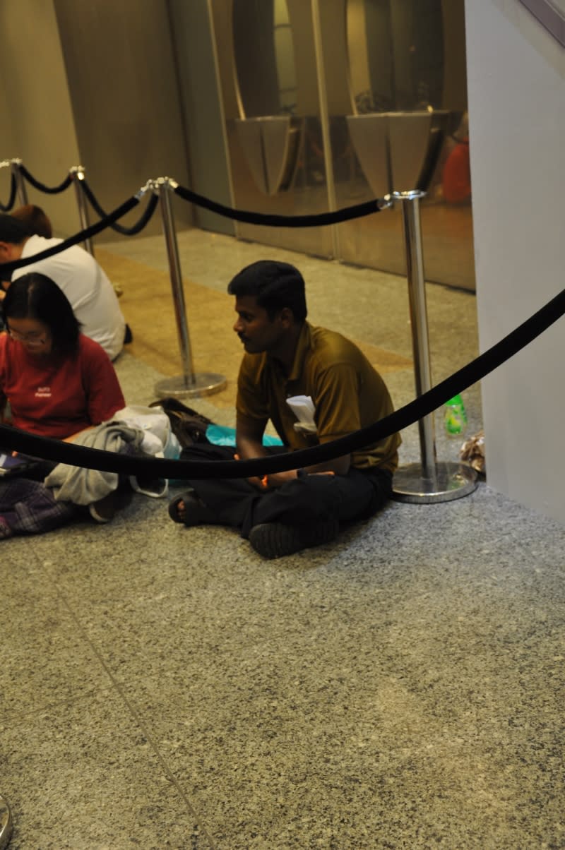 Foreign worker Selvam, who works as an electrician, was the first in queue. At the behest of his employer, Selvam stood in queue since 9.30am so his boss can be the very first SingTel customer to own an iPhone 4S.