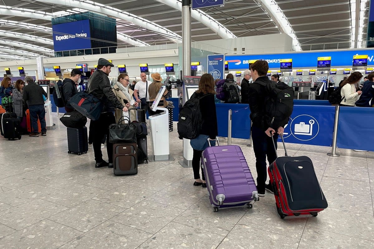 Passengers at Heathrow Airport  (PA Wire)