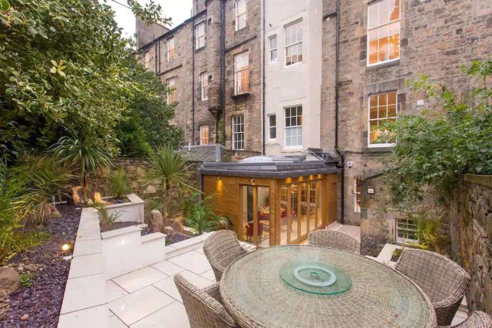 <p>A stunning house with interiors comparable to a five-star hotel, this luxury Airbnb has it all: the comfort, opulence, space and location. The sleek apartment is situated on prestigious Rutland Square, just seconds away from Princes Street. It boasts original Georgian architecture as well as tech essentials, such as the keypad video entry system and remote-controlled gas fire.<br></p><p><strong>Sleeps: </strong>6</p><p><strong>Make sure you... </strong>have dinner in the private, landscaped garden. </p><p><a class="link " href="https://airbnb.pvxt.net/kjXLon?trafcat=summer" rel="nofollow noopener" target="_blank" data-ylk="slk:BOOK HERE;elm:context_link;itc:0;sec:content-canvas">BOOK HERE</a></p>