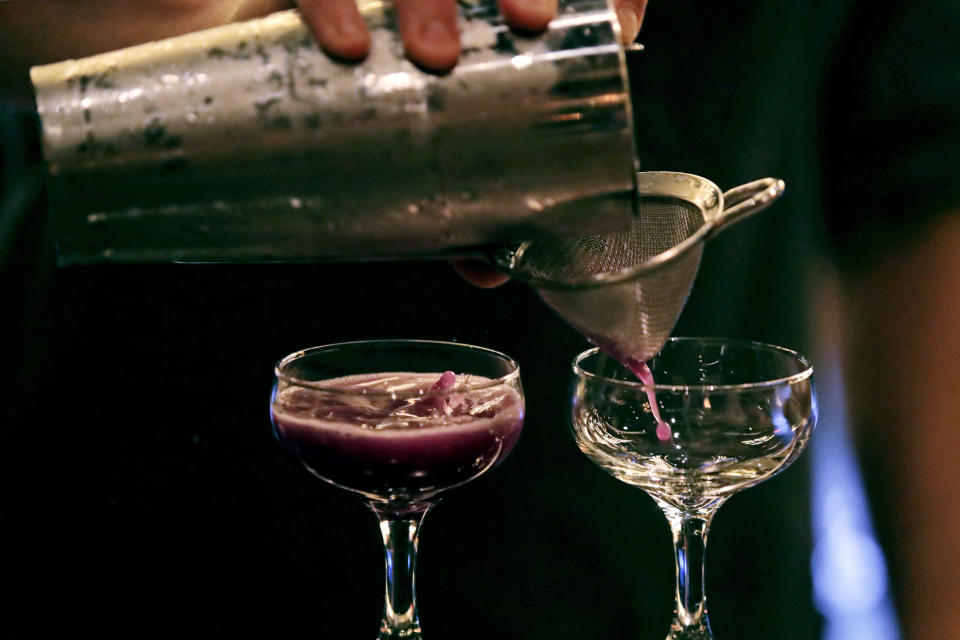 In this Dec. 10, 2019, photo cocktails are crafted at Wink & Nod, basement-dwelling, speakeasy-like bar, in Boston. Americans are consuming more alcohol per capita now than in the time leading up to Prohibition, when alcohol opponents successfully made the case that excessive drinking was ruining family life. (AP Photo/Charles Krupa)