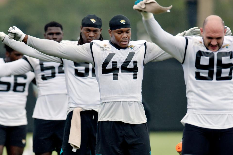 Jacksonville Jaguars edge rusher Travon Walker (44), seen here going through warmup drills Friday in training camp, expects to bring more moves and play faster in 2023 to help fortify the team's pass rush.
