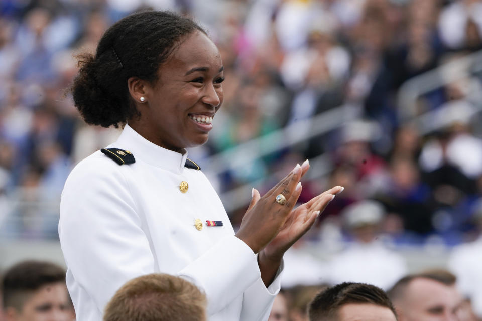 Midshipman Sarah Skinner, who is a Rhodes Scholar, reacts as President Joe Biden recognizes her during the U.S. Naval Academy's graduation and commissioning ceremony at the Navy-Marine Corps Memorial Stadium in Annapolis, Md., Friday, May 27, 2022. (AP Photo/Manuel Balce Ceneta)