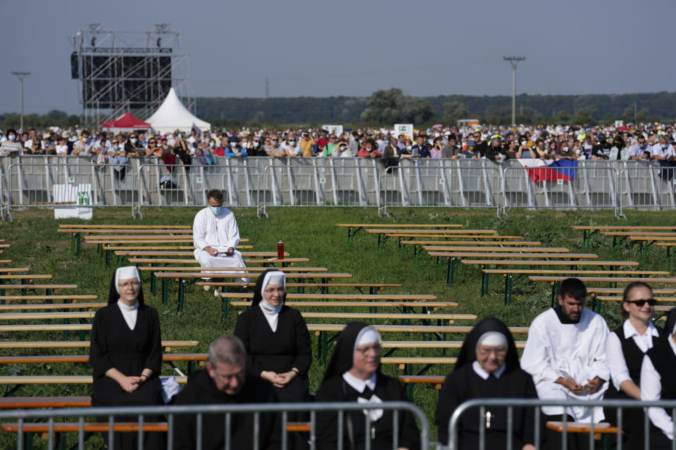 People attend a Mass celebrated by Pope Francis in the esplanade of the National Shrine in Sastin, Slovakia, Wednesday, Sept. 15, 2021. Pope Francis celebrated an open air Mass in Sastin, the site of an annual pilgrimage each September 15 to venerate Slovakia's patron, Our Lady of Sorrows (AP Photo/Petr David Josek)