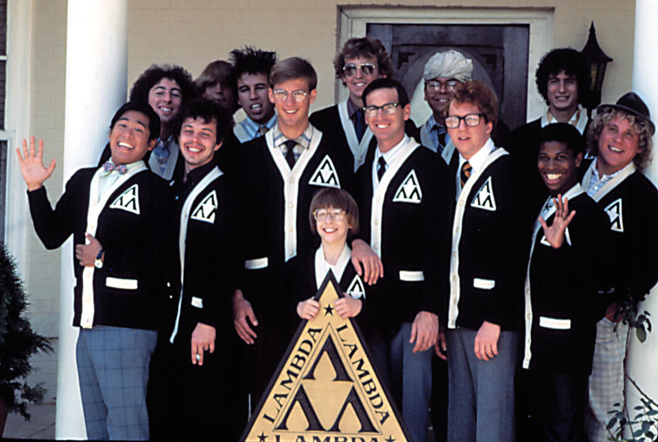 A group of men in a fraternity stand together