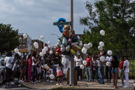 The Wider Image: Baltimore pushes back against Trump while acknowledging problems