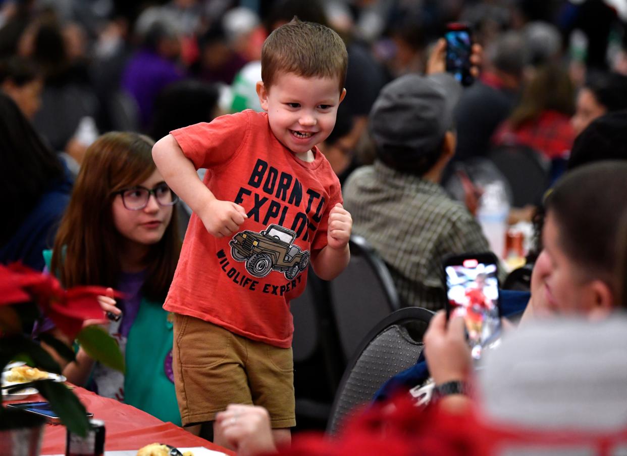 Beckett Wuertzer, 3, dances to live music for his parents Ryan and Roxxanne at Tuesday's H-E-B Feast of Sharing in the Abilene Convention Center.