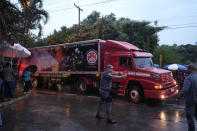 A refrigerated truck from the fire department arrives at the gated community where a plane crashed in Vinhedo, Sao Paulo state, Brazil, Friday, Aug. 9, 2024. (AP Photo/Andre Penner)