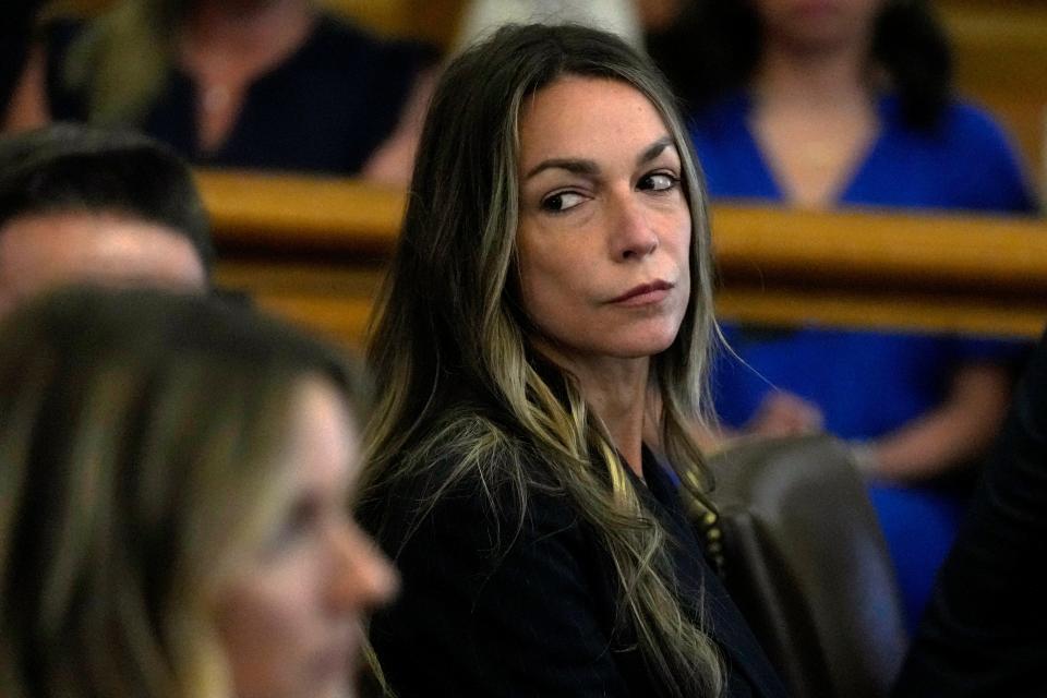 Karen Read watches as jurors are seated in court to continue with deliberations at the trial of Read at Norfolk Superior Court, Friday, June 28, 2024, in Dedham, Mass. Read, 44, is accused of running into her Boston police officer boyfriend with her SUV in the middle of a nor'easter and leaving him for dead after a night of heavy drinking. (AP Photo/Charles Krupa, Pool)