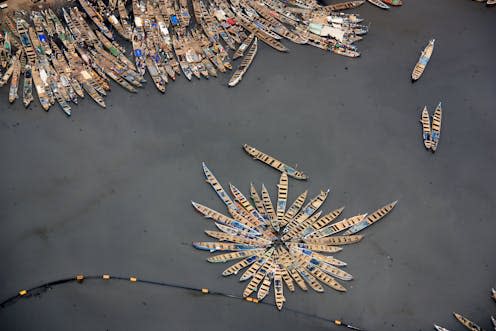 <span class="caption">Artisan fishers in the port of Tema, Ghana.</span> <span class="attribution"><a class="link " href="https://www.shutterstock.com/image-photo/aerial-view-fishing-boats-moored-together-1057262366" rel="nofollow noopener" target="_blank" data-ylk="slk:schusterbauer.com/Shutterstock;elm:context_link;itc:0;sec:content-canvas">schusterbauer.com/Shutterstock</a></span>