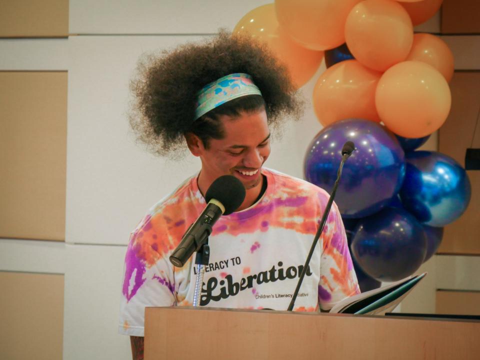 Mychal Threets reads at an event in Philadelphia. The librarian and social media activist is working with Children's Literacy Initiative and PBS Kids to promote reading.