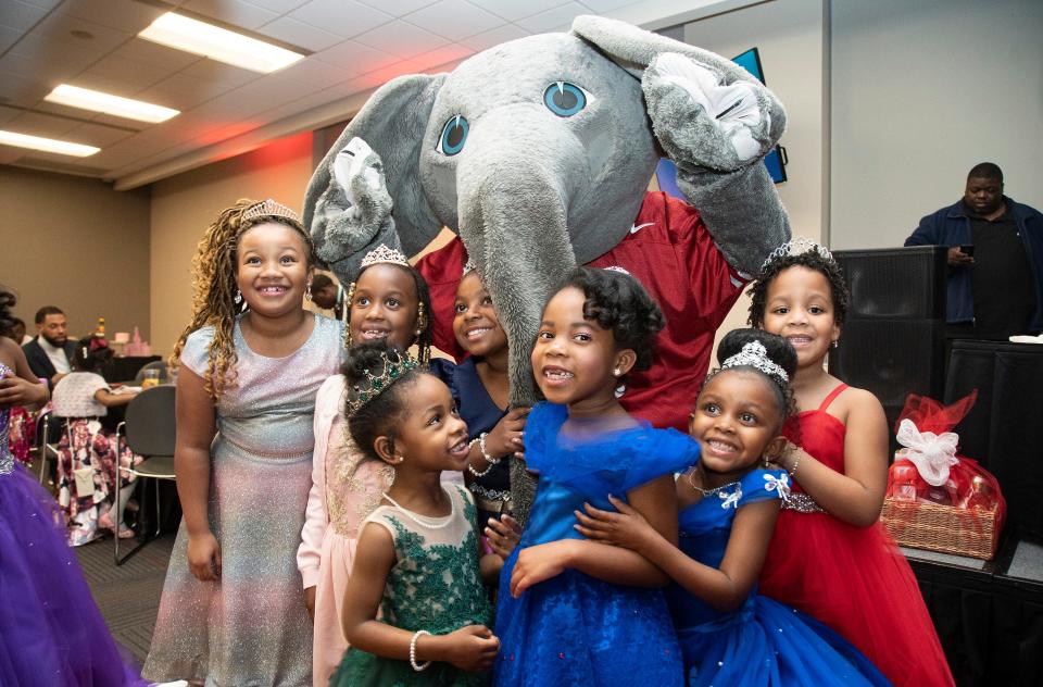 Princesses pose with Big Al at the princess ball, a father daughter dance at Bryant Conference Center in Tuscaloosa, Ala. on Saturday, Feb. 8, 2020. [Photo/Jake Arthur]