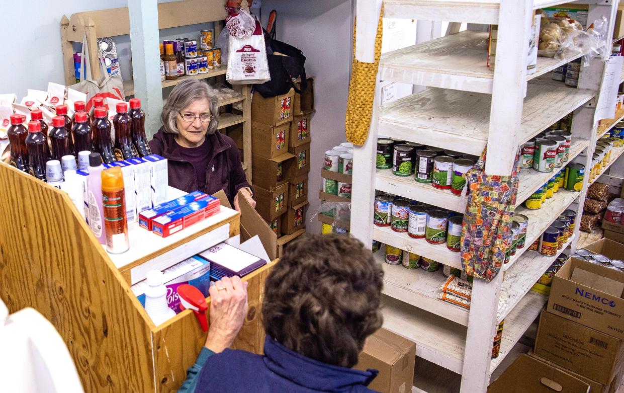 Dryden Kitchen Cupboard volunteers Phyllis Byrn, left, and Marlene Winter, right, organize food on Friday, Feb. 24, 2023. Located at 6 North St., the free food pantry is open from 11 a.m. until noon every Monday and Friday, 5 - 6 p.m. on Wednesdays, and on the last Saturday of the month from 11 a.m. until noon.