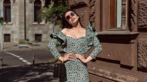 Young woman walking in summer city