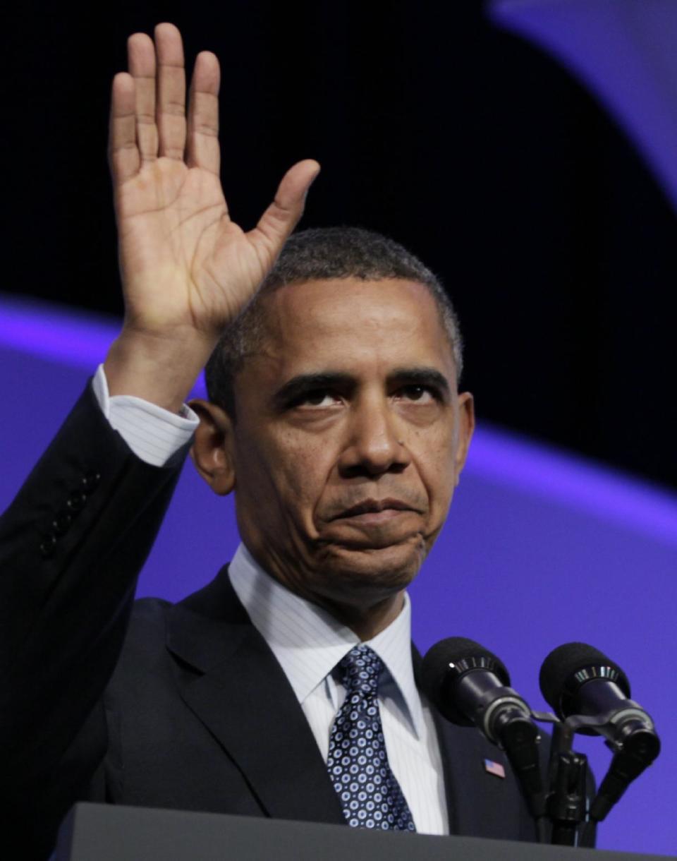 President Barack Obama waves as he leaves The Associated Press luncheon during the ASNE Convention, Tuesday, April 3, 2012, in Washington. (AP Photo/Carolyn Kaster)