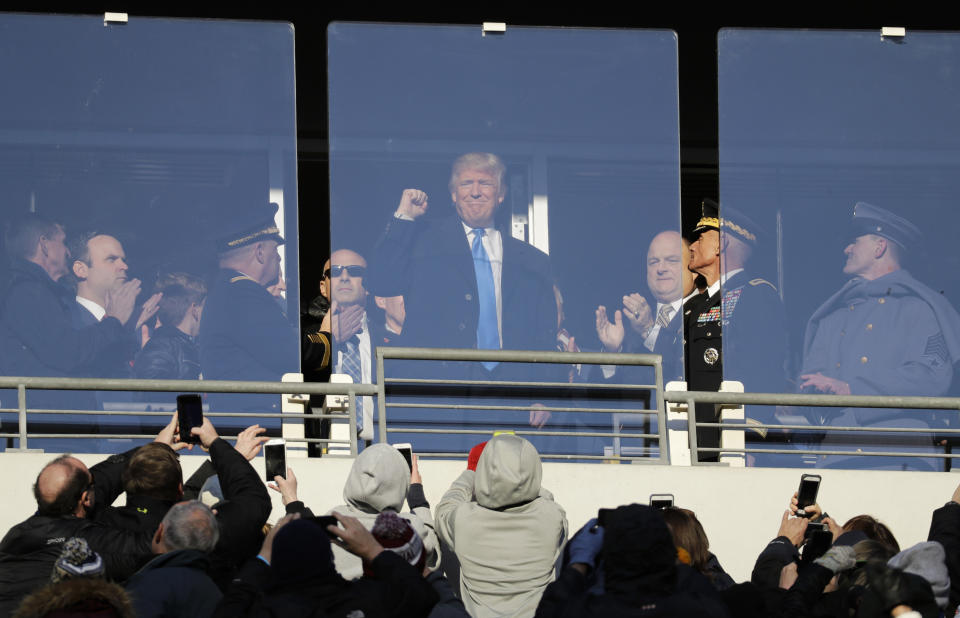 FILE - In this Saturday, Dec. 10, 2016, file photo, then President-elect Donald Trump acknowledges spectators during the first half of the Army-Navy NCAA college football game in Baltimore. President Trump will attend the Army-Navy football game, Saturday, Dec. 8, 2018, in Philadelphia. (AP Photo/Patrick Semansky, File)