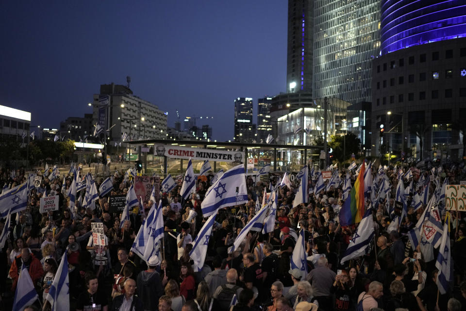 People protest against Israeli Prime Minister Benjamin Netanyahu's government and call for the release of hostages held in the Gaza Strip by the Hamas militant group, in Tel Aviv, Israel, Saturday, April 20, 2024. (AP Photo/Leo Correa)