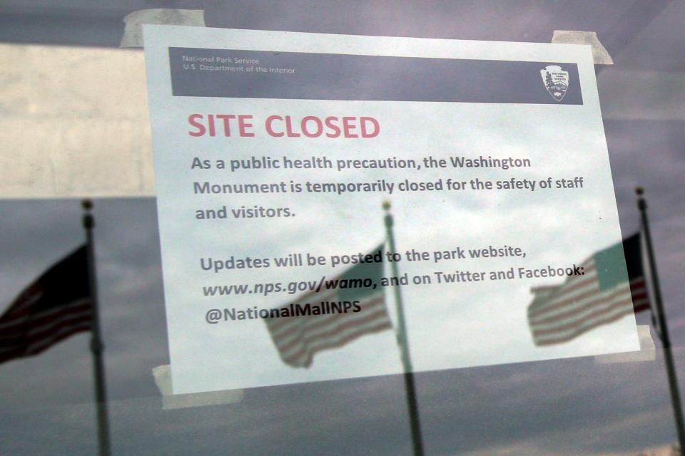 A closure note due to coronavirus disease (COVID-19) is seen at the entrance to the Washington Monument in Washington, U.S., March 14, 2020. REUTERS/Yuri Gripas