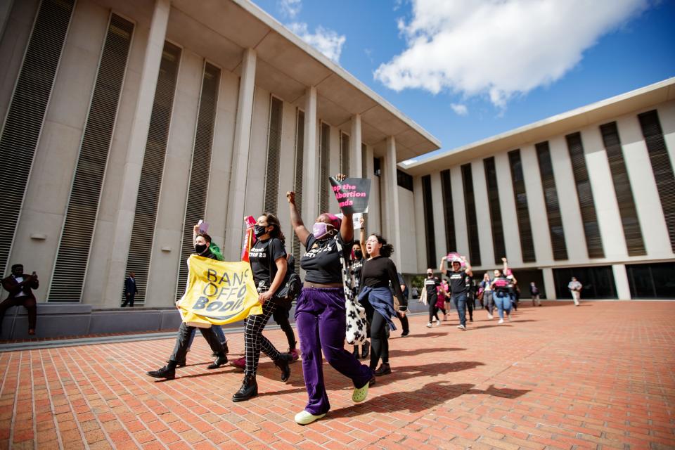 Opponents of HB 5, a bill filed in the Florida Legislature that would ban abortions in the state after 15 weeks after pregnancy, rallied at the Florida Capitol, Wednesday, Feb. 16, 2022.