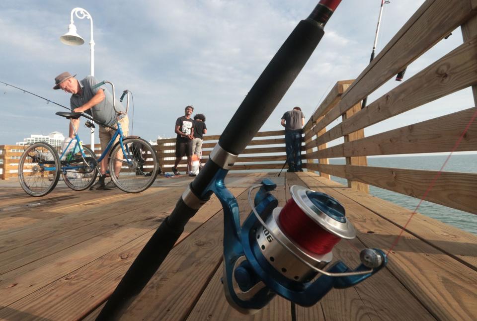 Anglers try their luck on the end of the resently reopened Daytona Pier, Thursday July 27, 2023 