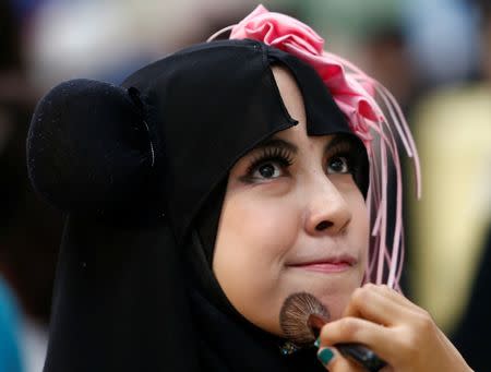 A Muslim cosplayer poses during a cosplay event at a mall in Petaling Jaya, near Kuala Lumpur, Malaysia July 8, 2017. Picture taken July 8, 2017. REUTERS/Lai Seng Sin