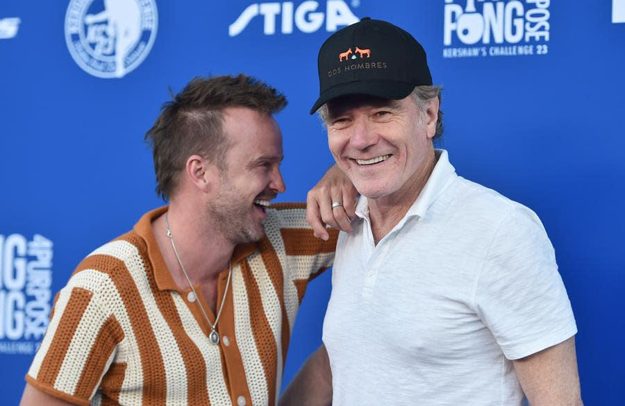 (Left to Right) Aaron Paul and Bryan Cranston enjoy the 10th annual Ping Pong 4 Purpose Celebrity Tournament at Dodger Stadium in Los Angeles. (Alberto E. Rodriguez/Getty Images)