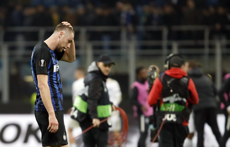Inter Milan's Milan Skriniar walks on the pitch at the end of the Europa League round of 16 second leg soccer match between Inter Milan and Eintracht Frankfurt at the San Siro stadium in Milan, Italy, Thursday, March 14, 2019. (AP Photo/Antonio Calanni)