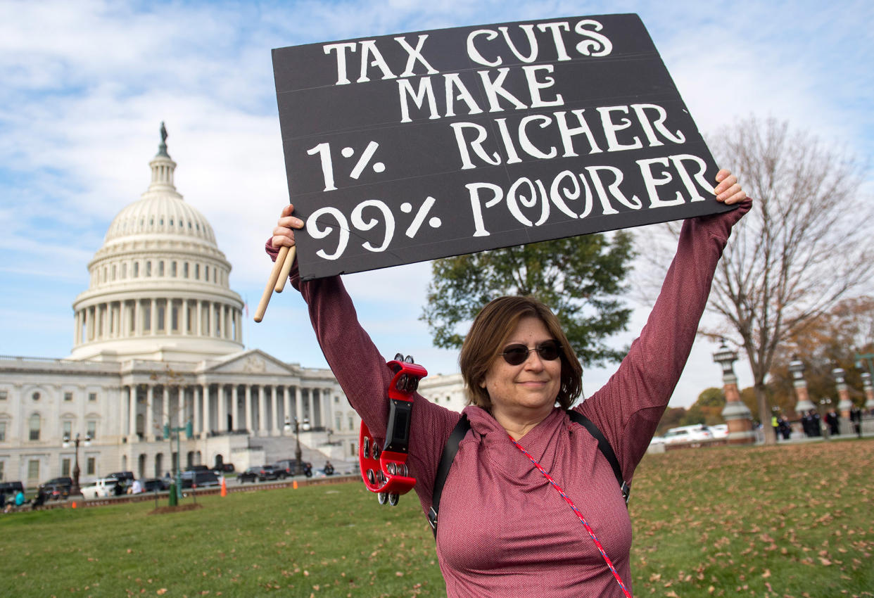 Demonstrators protest against the Republican tax reform plan during a rally organized by Our Revolution and Americans for Tax Fairness Action Fund on Capitol Hill in Washington, DC, November 15, 2017. Saul Loeb | AFP | Getty Images