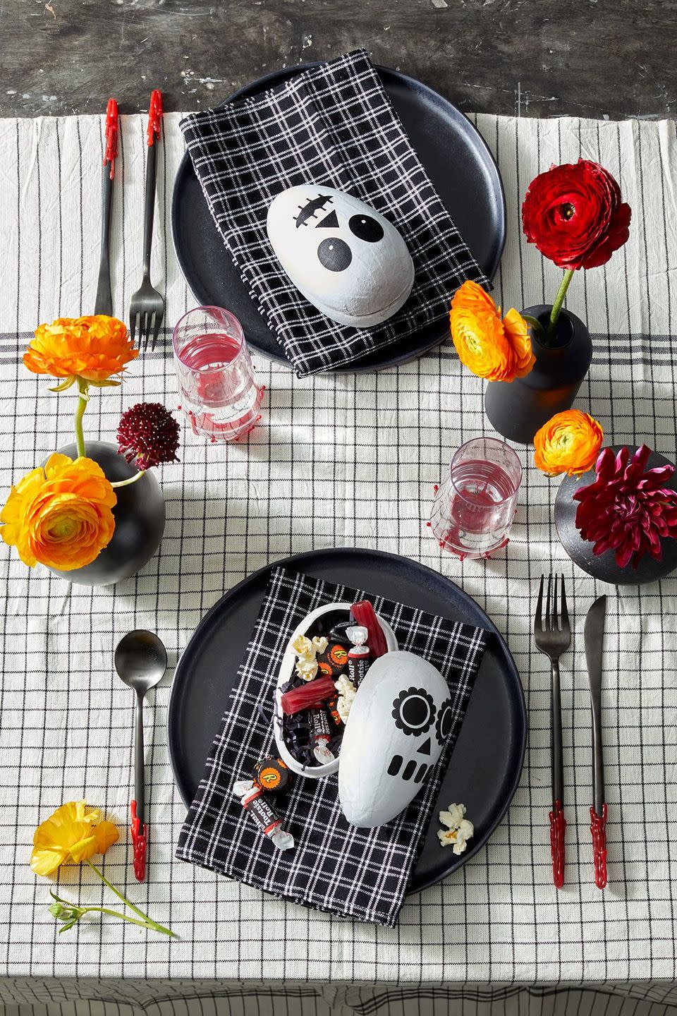 <p>Each guest can go home with one of these boxes. Fill 'em with candy or another treat to create decor as well as a party favor. To make, spray paint all of the egg boxes white inside and out and let dry completely. Cut out <a href="https://www.goodhousekeeping.com/holidays/halloween-ideas/a33564450/gh-halloween-artwork-calligraphy-templates/" rel="nofollow noopener" target="_blank" data-ylk="slk:the skeleton face templates;elm:context_link;itc:0;sec:content-canvas" class="link ">the skeleton face templates</a> out of black craft paper with scissors or a craft knife or make your own! Glue on the paper face pieces using a light layer of tacky glue and make sure you securely press down the pieces since the egg is round. </p><p><a class="link " href="https://www.amazon.com/d%C3%A9copatch-Mache-Medium-Egg-Brown/dp/B00SOUYRAC/?tag=syn-yahoo-20&ascsubtag=%5Bartid%7C10055.g.1566%5Bsrc%7Cyahoo-us" rel="nofollow noopener" target="_blank" data-ylk="slk:SHOP EGG-SHAPED BOXES;elm:context_link;itc:0;sec:content-canvas">SHOP EGG-SHAPED BOXES</a></p>