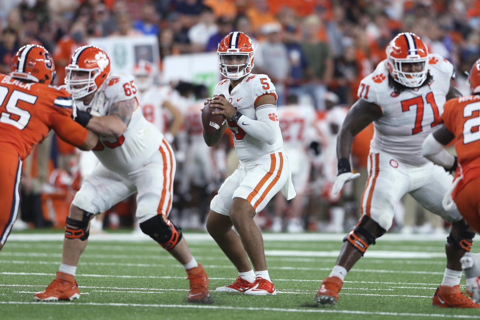 Clemson quarterback D.J. Uiagalelei (5) looks for a receiver during the fourth quarter of the team's NCAA football game against Syracuse in Syracuse, N.Y., Friday, Oct. 15, 2021. (AP Photo/Joshua Bessex)