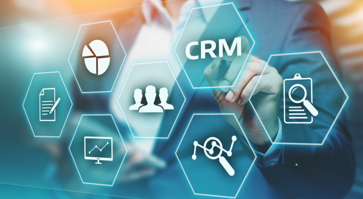A concept image of a person looking at several hexagonal icons representing concepts in customer relationship management (CRM).