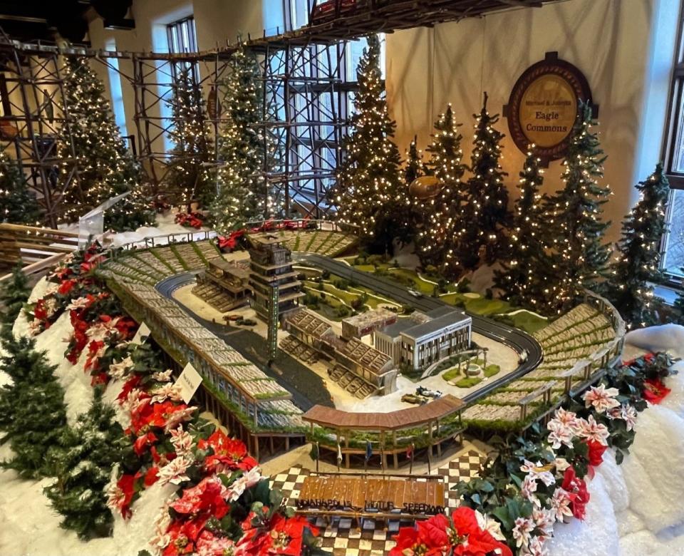 The Indianapolis Motor Speedway at Jingle Rails races slot cars.