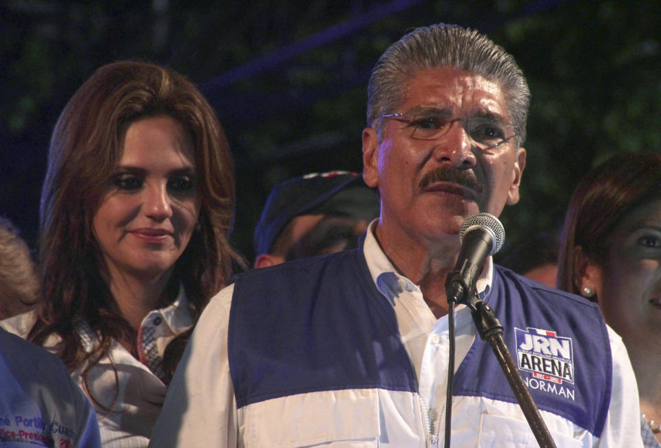 Norman Quijano, presidential candidate for the Nationalist Republican Alliance (ARENA), speaks to supporters after partial results were announced that put him behind in the presidential runoff election in San Salvador, El Salvador, Sunday, March 9, 2014. El Salvador's too-close-to-call presidential runoff election has raised competing claims of victory from Salvador Sanchez Ceren, a former fighter for leftist guerrillas and the candidate of the once long-ruling conservative party that fought a civil war from 1980 to 1992. Quijano said his party was on "a war footing" and vowed "to fight with our lives, if necessary" to defend what he claimed was his victory. (AP Photo/Salvador Melendez)