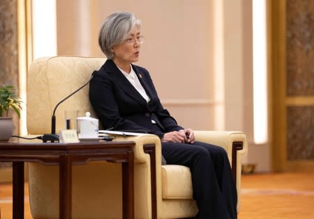 South Korean Foreign Minister Kang Kyung-wha speaks to Chinese Premier Li Keqiang during their meeting with Japanese Foreign Minister Taro Kono (not pictured) at the Great Hall of the People (GHOP) in Beijing