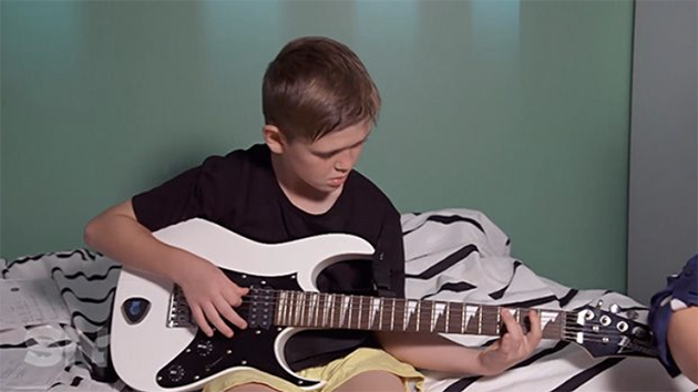 Cameron loves to play guitar, and finds that it helps his Tourette's.