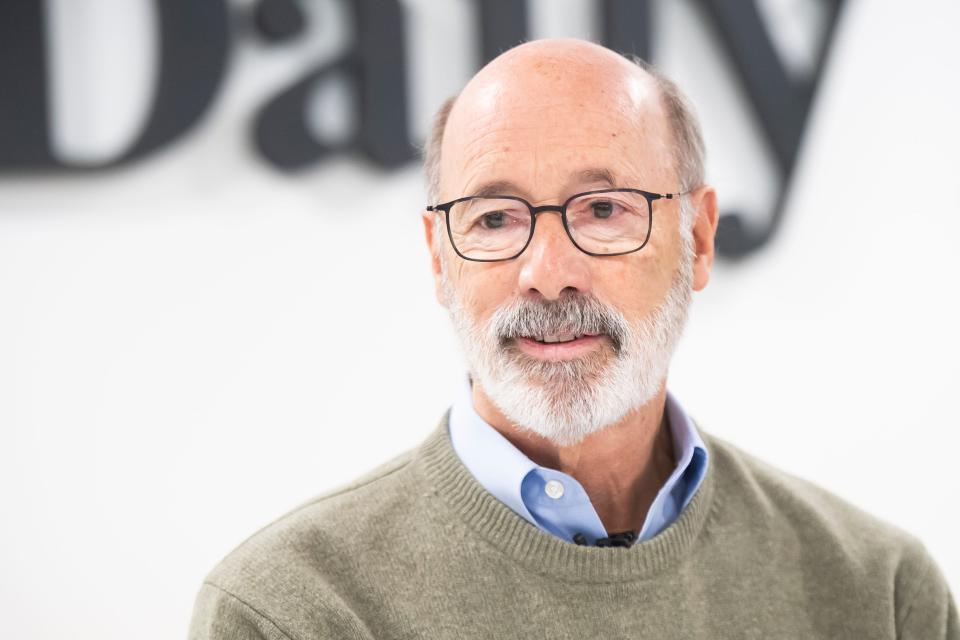 Former Pennsylvania Governor Tom Wolf talks to reporter Teresa Boeckel during an interview at the York Daily Record, Dec. 14, 2023.