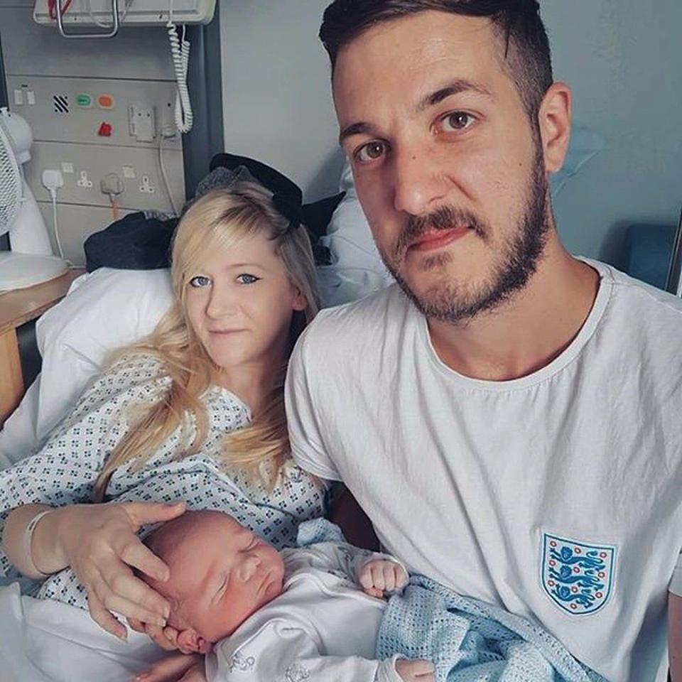 Chris Gard and Connie Yates with their son Charlie - Credit: PA