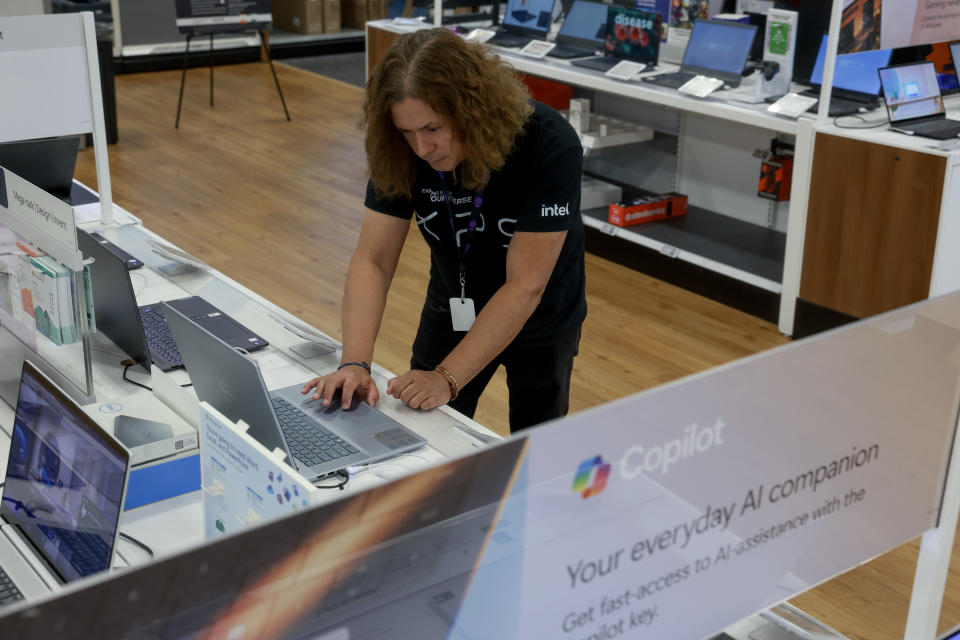 MIAMI, FLORIDA - JUNE 18: Omar Sawaya, with Dell computer, looks at computers on display with the Microsoft Copilot+ installed at the Best Buy store on June 18, 2024 in Miami, Florida. Today, Best Buy began selling Microsoft's new line of AI-centric Copilot+ PCs to customers. The store has the most extensive assortment of Copilot+ PCs in their stores from vendors like Microsoft, Dell, HP, Lenovo, and Samsung. Microsoft Copilot is a generative artificial intelligence chatbot developed by the company. (Photo by Joe Raedle/Getty Images)